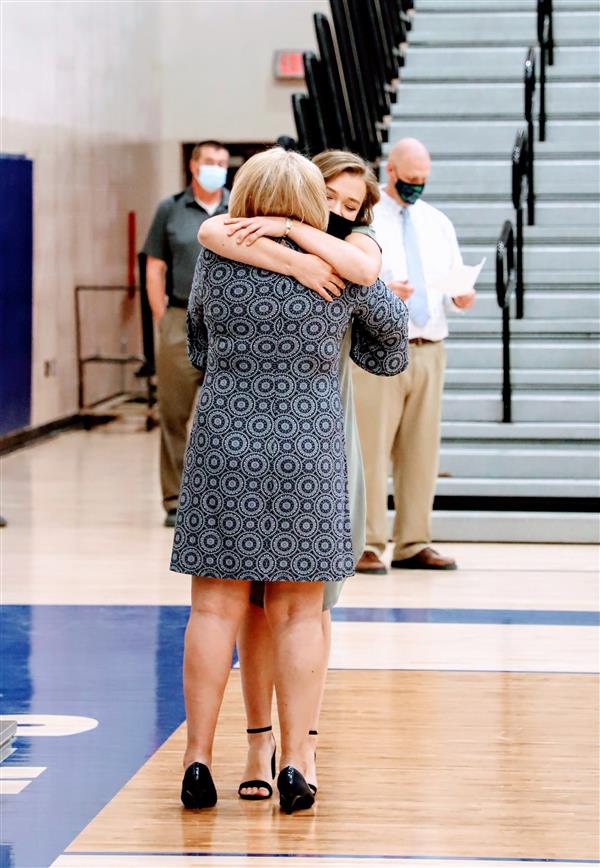 Ms. Nelson giving her daughter, Senior Sydney Nelson, a congratulatory hug.